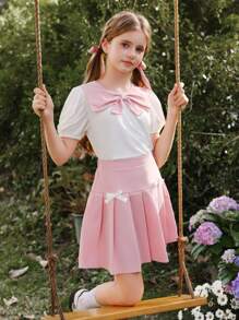 Wildeya Tween-Mädchen 2-teiliges Set, weiße Bluse mit Rüschen, Puffärmeln, Schleifenkragen und rosa Minirock mit Falten, Frühling/Sommer