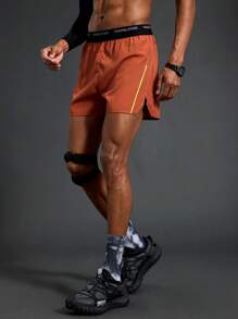 Manfinity Sport Polished Shorts esportivos com fenda lateral e cós em bloco de cores masculino