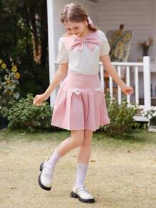 Wildeya Tween-Mädchen 2-teiliges Set, weiße Bluse mit Rüschen, Puffärmeln, Schleifenkragen und rosa Minirock mit Falten, Frühling/Sommer