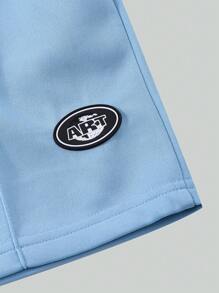 SHEIN 1 Pc Boys Casual Plain Loose Shorts, Featuring Minimalist Design With Patch At Hem. These Lightweight Blue Shorts Are Perfect For Summer Leisurewear, Suitable For Various Skin Tones And Occasions. The Simple Yet Elegant Design Prioritizes Comfort.