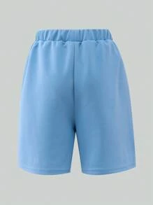 SHEIN 1 Pc Boys Casual Plain Loose Shorts, Featuring Minimalist Design With Patch At Hem. These Lightweight Blue Shorts Are Perfect For Summer Leisurewear, Suitable For Various Skin Tones And Occasions. The Simple Yet Elegant Design Prioritizes Comfort.