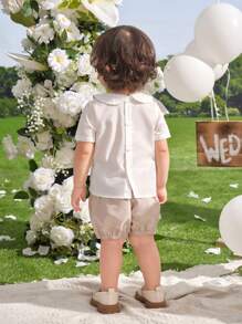 SHEIN Leap Crew 2 piezas Conjunto elegante de niño pequeño de color albaricoque para pajecillo y portador de anillo, incluye Top de manga corta con cuello con ribete de cinta y shorts de cintura elástica, adecuado para fiesta de cumpleaños, bautizo, 1er cumpleaños, fiesta de noche, actuación, boda y otras ocasiones - Albaricoque - Ver 2