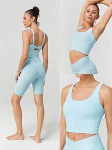 GLOWMODE Parte superior deportiva tipo tanque FeatherFit™ con espalda retorcida, de bajo impacto, para yoga y uso diario