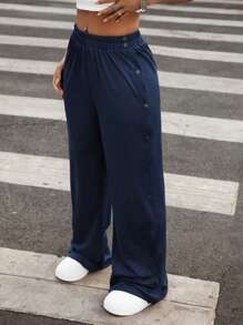 Hanevo 纽扣门襟开衩侧宽松镂空女式长裤