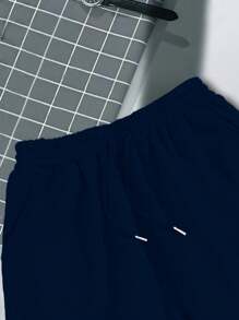 Manfinity Dauomo Men's Solid Color Patchwork Short Sleeve Numeric Print Simple Top And Shorts Set