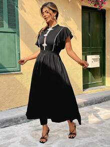 Flirla Robe longue simple en patchwork de couleurs, pour grande taille. Portée de manière décontractée au quotidien