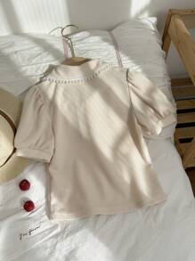 Zomers modieus en elegant geplooide kraag pofmouw T-shirt top, jong meisje