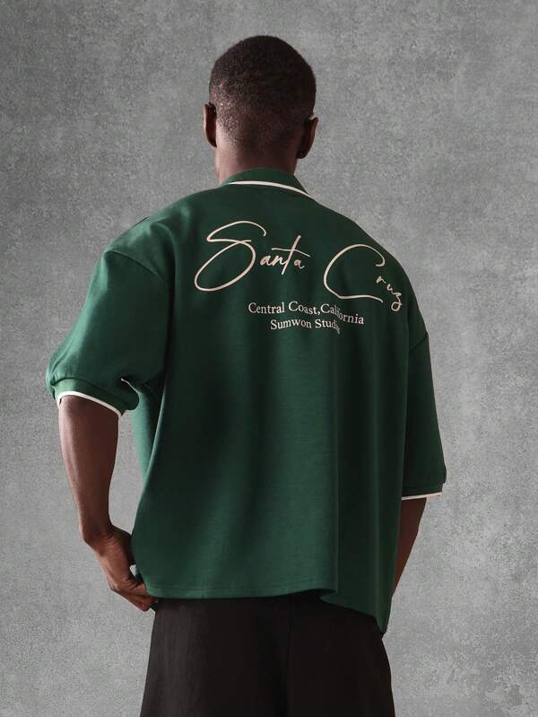 SUMWON Polo premium brodé avec signature Santa Cruz Californie. Collection Sumwon Studio. Polo classique athlétique casual avec fermeture éclair et surpiqûres contrastées. Streetwear urbain