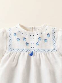 SHEIN Set de 2 piezas con top de manga corta y abullonada de cuello redondo y pantalones cortos con estampado floral para niña - Multicolor - Ver 9