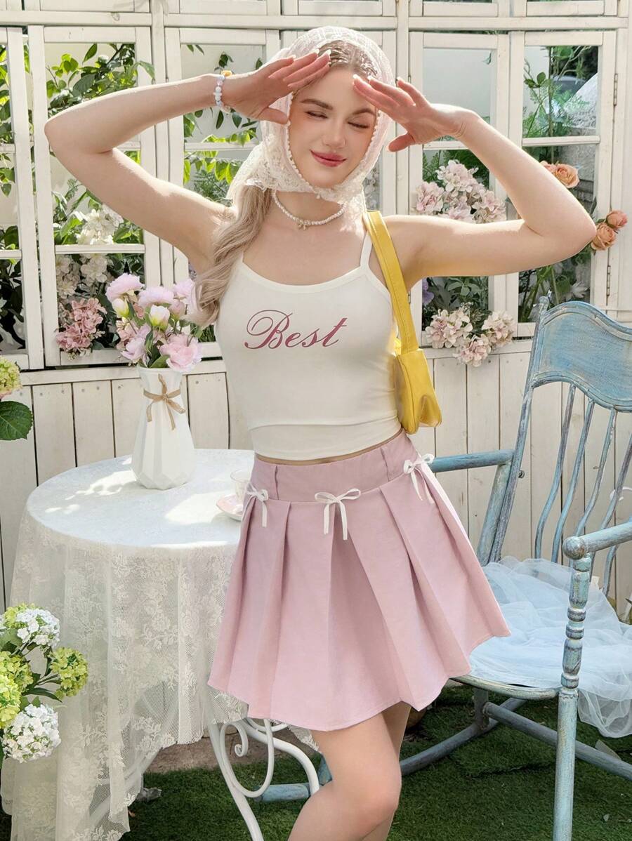SHEIN Conjunto de 2 piezas de falda mini plisada con decoración de lazo y tirantes, estilo casual y cómodo para adolescentes - Blanco - Ver 1