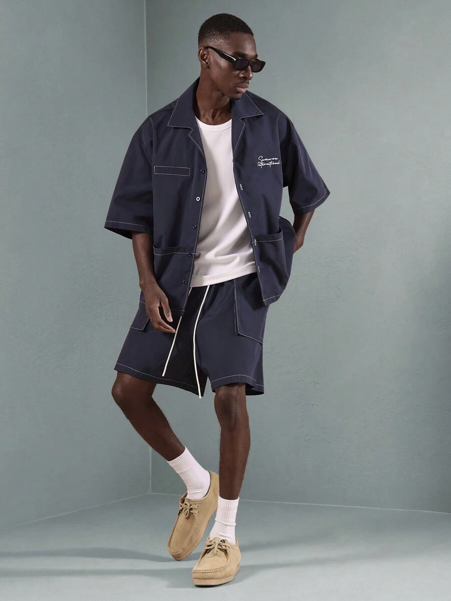 SUMWON Conjunto premium de diseñador, estilo de ropa de trabajo unisex con camisa con botones oversize y pantalón corto. Conjunto casual de fin de semana, streetwear de moda urbana y moderna para primavera y verano - Azul - Ver 1