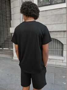 PAVTROS Men's Graphic Print Short Sleeve T-Shirt And Shorts Set, Making It An Excellent Gift Idea For Boyfriends Or Husbands. Men Clothes Men T Shirt Co Ords Graphic Tees For Men,Men's Young Street Style, INS Versatile Best-Selling  T-Shirt Set , The Personalized Patterns On The Chest And Shorts Are Full Of Fashion Sense. The Overall Style Is Avant-Garde And Bold, Showing A Unique Street Fashion Atmosphere, Suitable For Outdoor Sports And Leisure Occasions. - Black - View 2