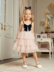 فستان كيك شابة حلو و جميل، بلون المشمش، مزين بفيونكة سوداء مفصلة، تنورة متكدسة من التول، سيلويت على شكل حرف A أنيق، مناسب للخارج والكاجوال والحفلات وأكثر المناسبات - لون مشمشي - مشاهدة 1