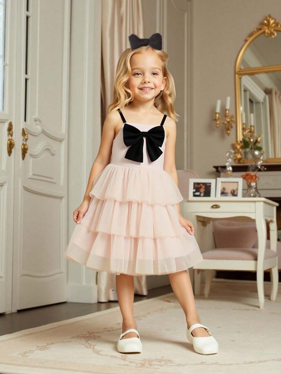 فستان كيك شابة حلو و جميل، بلون المشمش، مزين بفيونكة سوداء مفصلة، تنورة متكدسة من التول، سيلويت على شكل حرف A أنيق، مناسب للخارج والكاجوال والحفلات وأكثر المناسبات - لون مشمشي - مشاهدة 1