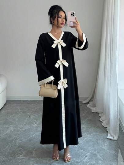 فستان نسائي فضفاض بأكمام طويلة بلوحات لونية وفرجار...