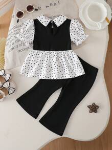 SHEIN Playful Pals Baby Girl Spring And Summer Holiday Charm 2 Pieces Set, Made With Quality Fabrics And Featuring A Playful Polka Dot Pattern For A Fashionable Minimalist Style. The Ruffle Collar Puff Sleeve Top Paired With Flared Pants Providing Comfort; Additionally, It Works Well For Light Sports And Elegant Parties, Allowing The Little Princess To Shine In Any Occasion.