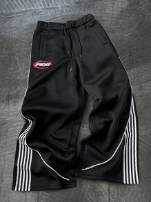 Manfinity Sporsity Men's Streetwear Academy INS Black Sweatpants With White Striped Color Block Design, Men's Striped Drawstring Waist Loose Fit Athletic Style Casual Sweatpants,Men's Black Sports Pants With Streamlined White Stripes And Red Letter Logo, Simple And Neat Design, Full Of Sporty Feeling. Suitable For Outdoor Sports And Leisure Occasions.