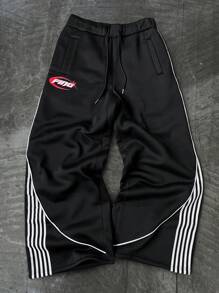 Manfinity Sporsity Men's Streetwear Academy INS Black Sweatpants With White Striped Color Block Design, Men's Striped Drawstring Waist Loose Fit Athletic Style Casual Sweatpants,Men's Black Sports Pants With Streamlined White Stripes And Red Letter Logo, Simple And Neat Design, Full Of Sporty Feeling. Suitable For Outdoor Sports And Leisure Occasions.