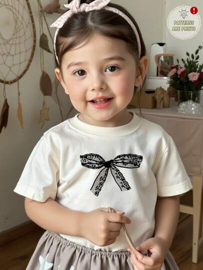 SHEIN Leap Crew Cute Bowknot Pattern Young Girl Casual Graphic Short Sleeve T-Shirt, Suitable For Summer