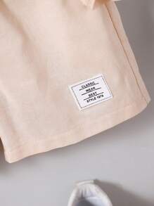 SHEIN 2 Pieces Set Young Boy Solid Color Short Sleeve Patch-Up Shirt And Letter Print Shorts, Casual Wear