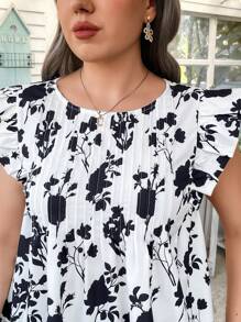 Flirla Chemise à manches courtes à imprimé floral noir pour femmes grandes tailles, style vacances - Noir et Blanc - Voir 1