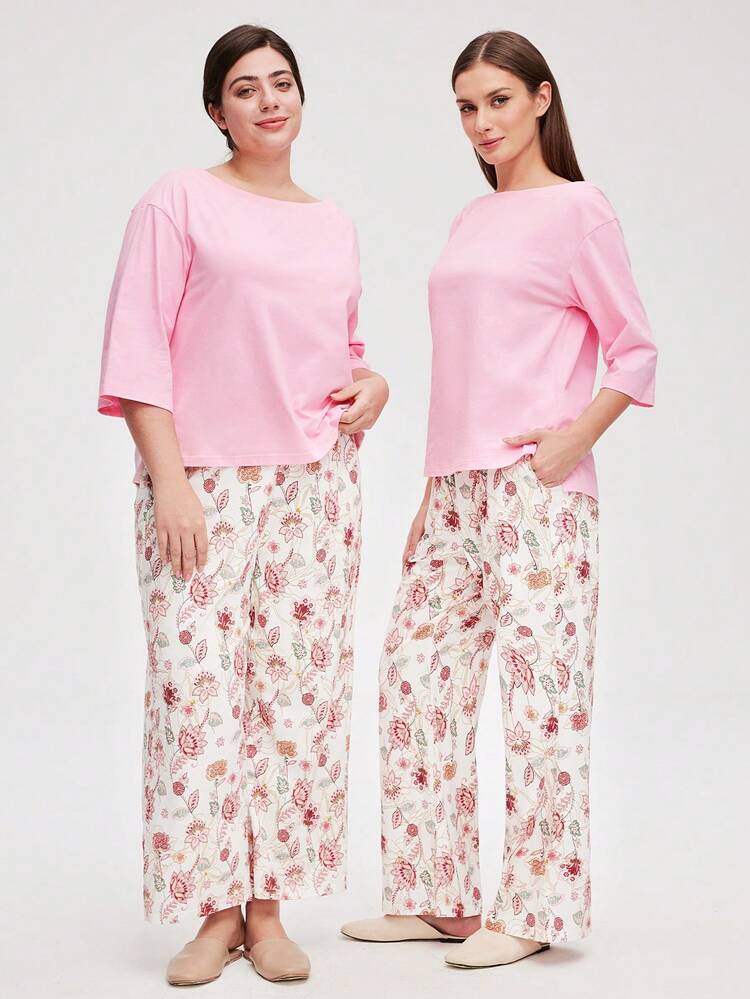 Ensemble de pyjama femme grande taille rose en coton doux, avec top col bateau et pantalon à imprimé floral. Pantalon de loungewear avec poches. Lingerie pouvant être portée comme vêtement de sortie. Ensemble de détente pour femmes, idéal pour les mariées. Vêtements d'automne.