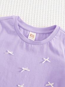 Cozy Pixies Áo chui đầu cổ tròn tay ngắn mềm mại có nơ trang trí cho bé gái - Màu tím hoa cà - Xem 6