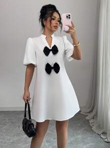 Elenzga Vestido mini de unicolor con cuello en V, mangas abullonadas y decoración de lazo, para mujer, nuevo para primavera/verano, de estilo casual y elegante - Blanco - Ver 3