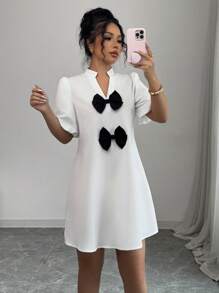 Elenzga Vestido mini de unicolor con cuello en V, mangas abullonadas y decoración de lazo, para mujer, nuevo para primavera/verano, de estilo casual y elegante - Blanco - Ver 5