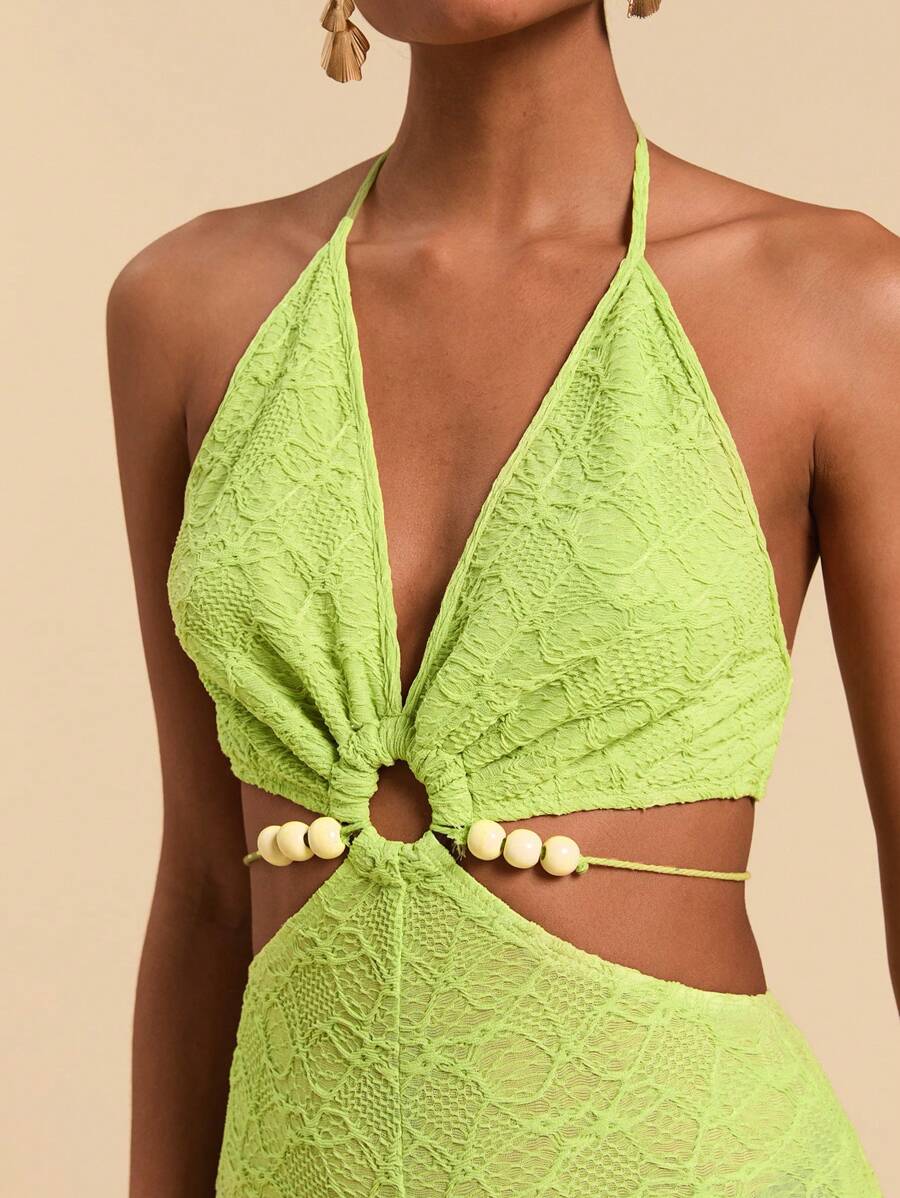 Travachic 春夏波西米亚绿色镂空露腰挂脖串珠修身喇叭连体裤假日风格性感女装