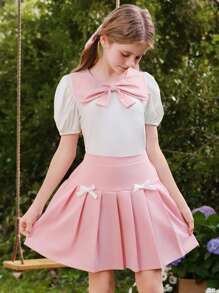 Wildeya Tween-Mädchen 2-teiliges Set, weiße Bluse mit Rüschen, Puffärmeln, Schleifenkragen und rosa Minirock mit Falten, Frühling/Sommer
