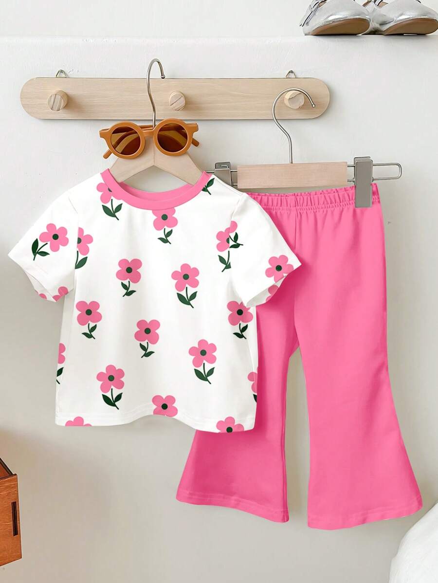 SHEIN Set de 2 piezas de niña joven con camiseta de cuello redondo de manga corta con estampado floral de dibujos animados y pantalones acampanados, apta para el verano - Multicolor - Ver 1