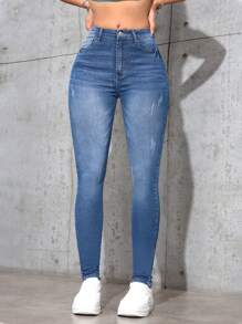 SHEIN Essnce Jeans de ajuste delgado con efecto lavado, estilo minimalista casual