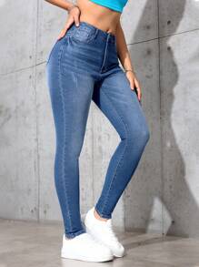 SHEIN Essnce Jeans de ajuste delgado con efecto lavado, estilo minimalista casual