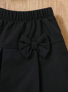 SHEIN 2-częściowy zestaw dla dziewczynek na wiosnę/lato - czarny elegancki minimalistyczny siateczkowy kokardkowy ozdobnik, dzianinowy top na ramiączkach i spódnica z kokardą