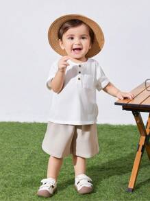 SHEIN 2pcs/Set Infant/Toddler Chest-Pocket Round Neck Short Sleeve Pullover Top And Solid Shorts Set, Suitable For Spring And Summer Everyday Wear - Khaki - View 1