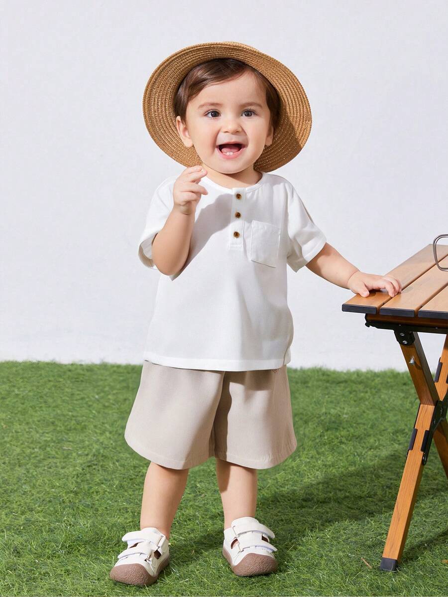 SHEIN 2pcs/Set Infant/Toddler Chest-Pocket Round Neck Short Sleeve Pullover Top And Solid Shorts Set, Suitable For Spring And Summer Everyday Wear - Khaki - View 1