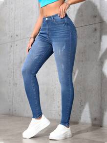 SHEIN Essnce Jeans de ajuste delgado con efecto lavado, estilo minimalista casual