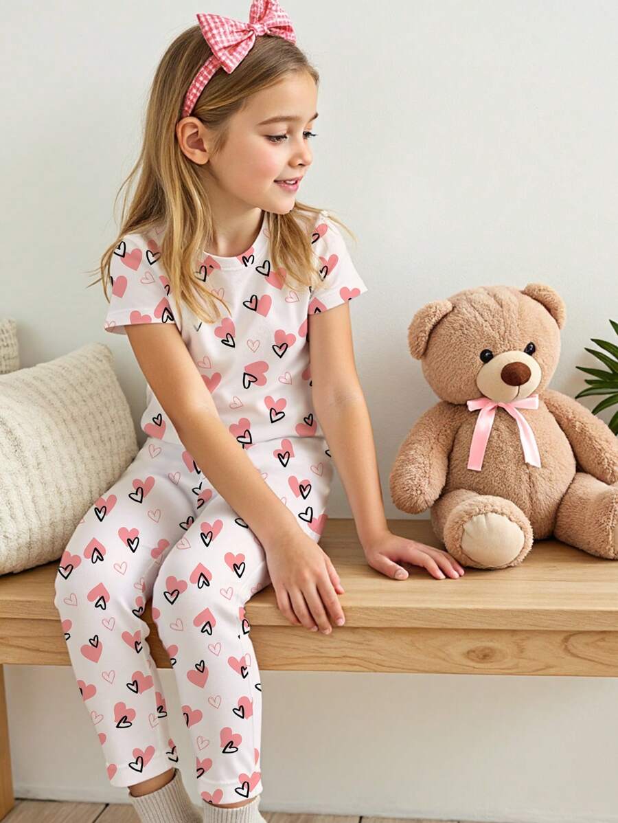 SHEIN Bộ đồ áo thun tay ngắn màu hồng họa tiết trái tim tối giản cho bé gái tuổi mới lớn và quần dài, đồ mặc ở nhà vừa vặn, mùa xuân/hè - Nhiều màu - Xem 1