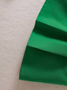 Set de 2 piezas de conjunto informal y lindo para niñas pequeñas, que incluye una blusa de punto de manga corta con cuello redondo y estampado de trébol para la primavera/verano, y una falda plisada de línea A de color liso