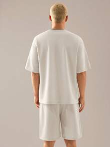 Manfinity VCAY 2 pièces Ensemble t-shirt à manches courtes décontracté lâche en tricot et short à taille élastique à jambe droite pour hommes