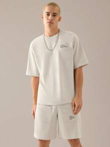 Manfinity VCAY 2 pièces Ensemble t-shirt à manches courtes décontracté lâche en tricot et short à taille élastique à jambe droite pour hommes