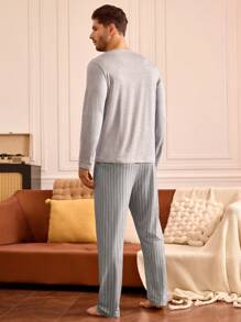 Conjunto de pijama para hombre con parte superior de manga larga con estampado de gatos y pantalón largo a rayas