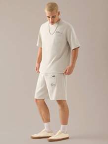 Manfinity VCAY 2 pièces Ensemble t-shirt à manches courtes décontracté lâche en tricot et short à taille élastique à jambe droite pour hommes