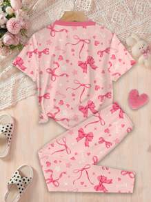 SHEIN Pijama minimalista informal de manga corta y pantalón para niñas preadolescentes, con moño rosa dulce y estampado en inglés, de ajuste ceñido, para primavera y verano