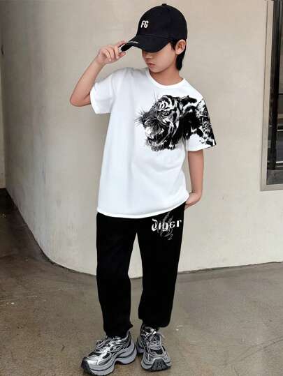 SHEIN Tween Boy Animal Print Set Including Short Sleeve Round Neck Tee And Long Pants, Suitable For Summer