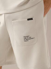 Manfinity VCAY 2 pièces Ensemble t-shirt à manches courtes décontracté lâche en tricot et short à taille élastique à jambe droite pour hommes