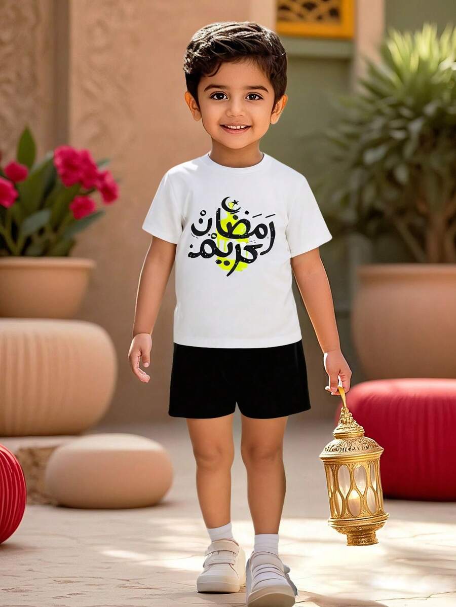 SHEIN 2 Summer Toddler Sets: 1 White Short Sleeved T-Shirt Paired With Black Sports Shorts. Suitable For Daily Wear, Vacation, School, And Sports