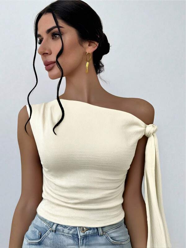 Firerie Blusa de mujer de estilo elegante y romántico para primavera, con cuello asimétrico, estilo elegante y sexy, adecuado para fiestas, vacaciones, citas románticas y vestidos de boda, con textura de punto y tirantes cruzados en los hombros, en color melocotón.