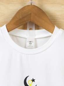 SHEIN 2 Summer Toddler Sets: 1 White Short Sleeved T-Shirt Paired With Black Sports Shorts. Suitable For Daily Wear, Vacation, School, And Sports